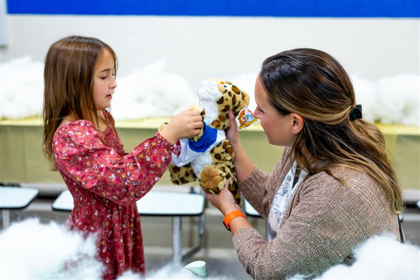 Students build a cheetah at a community event